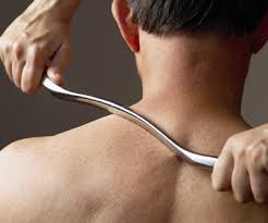 Person receiving Graston technique treatment